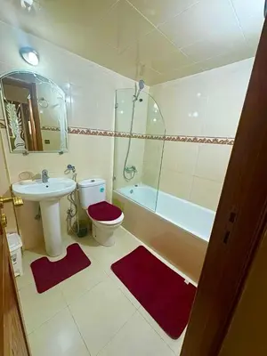 a bathroom with a sink and a toilet and a tub at apartment champs de cours in Fès
