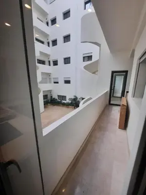 a room with a view of a building at Tanger Apt Near Train & Mall in Oulad Akkou
