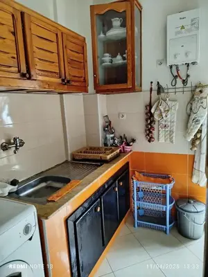 a kitchen with a sink and a counter top at appartement martil in Oulad Akkou