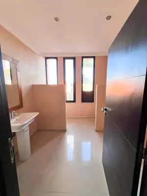 a large bathroom with a sink and a toilet at Villa Zeen Garden in Marrakech