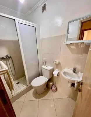 a bathroom with a toilet and a sink at nice apaprt in Oulad Akkou