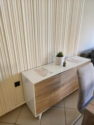 a desk with a potted plant on it next to a curtain at Azure's House in Fès