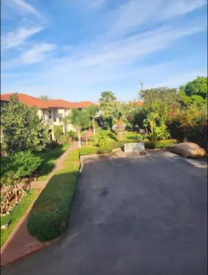 a parking lot in front of a house at Azure's House in Fès