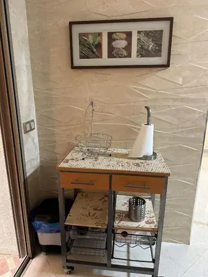 a table with a basket on it next to a wall at apartamente á fes in Fès