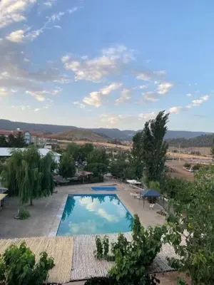 an overhead view of a swimming pool in a resort at Espace vert Chalet familial à Azrou in Azrou