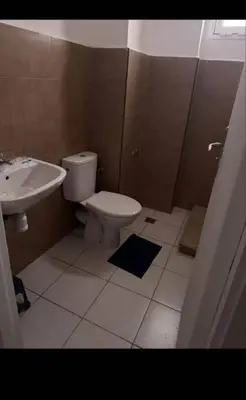 a bathroom with a white toilet and a sink at Almaz in Fès