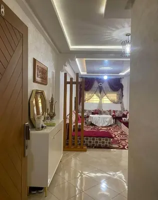 a room with a bedroom with a bed in it at Appart meublé pour location in Beni Mellal