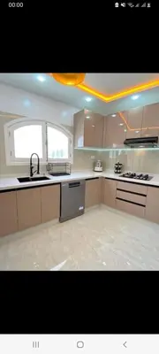 a large kitchen with a sink and a stove at Appart meublé pour location in Beni Mellal
