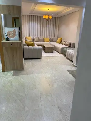 a large living room with couches and a television at Apartment Ocean view in Oulad Akkou