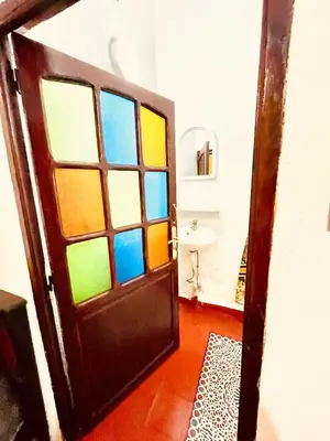a door with a bunch of windows in a room at Dar Bladi -A Quiet Place to Reset in Fes in Fès