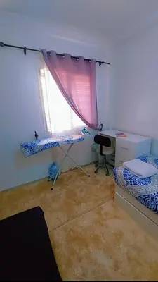 a room with a desk and a bed and a window at شقة اسراء قريبة من مطار مراكش المنارة الدولي in Oulad Akkou