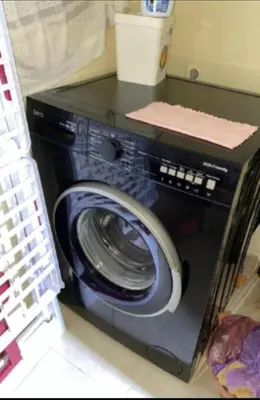 a washing machine with its door open in a room at شقة اسراء قريبة من مطار مراكش المنارة الدولي in Oulad Akkou
