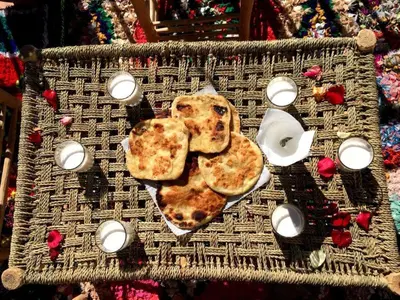 a basket with two pizzas on top of it at Gite Likemte Tachdirt in Tacheddirt