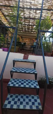 a set of steps with a checkered floor at Riad zineb in Fès