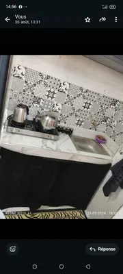 a picture of a table with two bowls on it at Petit appartement in Meknès