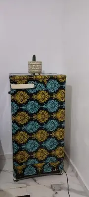 a dresser in a white wall with at Petit appartement in Meknès