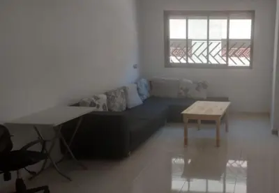a living room with a couch and a table at Les jardins de temara in Oulad Akkou