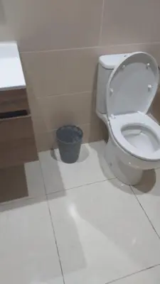 a bathroom with a white toilet in a room at Les jardins de temara in Oulad Akkou