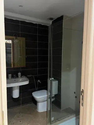 a bathroom with a toilet and a sink at Dyar lbahr in Oulad Akkou