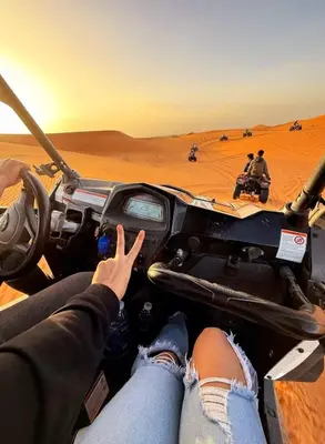 a group of people riding in a jeep in the desert at Yamanda luxury camp in Merzouga