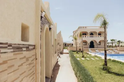 a view of a house and a swimming pool at Villa La Rêverie in Ain Cheggag