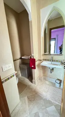 a bathroom with a sink and a mirror at Beautiful Moroccan-style villa in Douar Soukkane