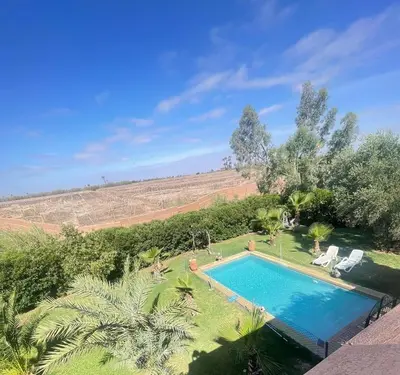 an overhead view of a swimming pool in a yard at Beautiful Moroccan-style villa in Douar Soukkane
