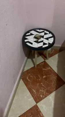 a stool sitting in a corner of a room at Résidence Kawtar Meknès in Meknès