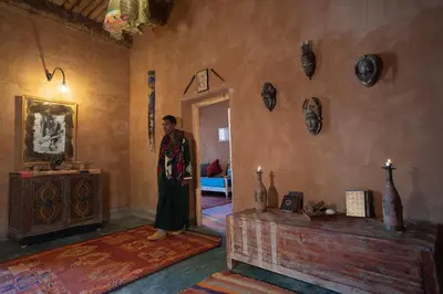 a man standing in a room with a wall at Casa Juan in Tagounite
