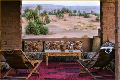 a living room with a couch and two chairs and a table at Casa Juan in Tagounite
