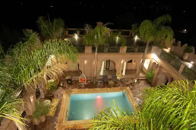 an overhead view of a swimming pool at night at Riad Rayhana De L Atlas in Ourika