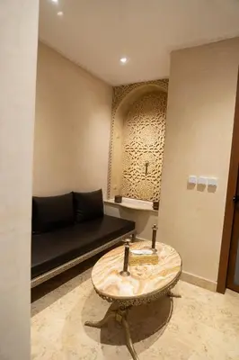 a living room with a couch and a table at Riad Rayhana De L Atlas in Ourika