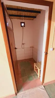 an empty bathroom with a shower in a room at Bivouac Le secret des dunes, lac Iriqui in Foum Zguid