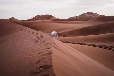 a small building in the middle of a desert at Sahara pathfinders in Mhamid