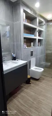 a bathroom with a sink and a toilet at Sublime appartement front de mer in Oulad Akkou