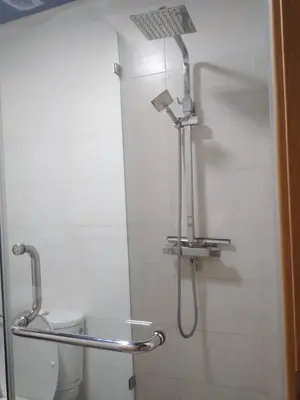 a shower with a shower head in a bathroom at Bir jdid in Oulad Akkou