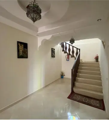 a hallway with stairs in a house at Dar Ezzaouiya in Ouzoud