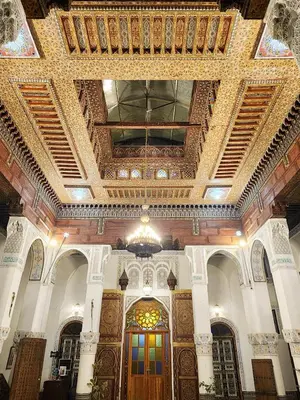 a large building with a ceiling and a door at Riad el Anaqa in Fès