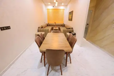 a conference room with a wooden table and chairs at Résidence Meknes Appt F4 in Meknès