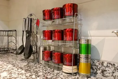 a rack of red cups on a kitchen counter at Résidence Meknes Appt F4 in Meknès