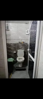 a small bathroom with a toilet and a shower at الحي المحمدي أكادير in Oulad Akkou