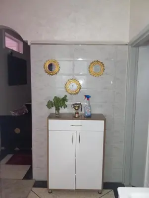 a room with a white cabinet and two mirrors at الحي المحمدي أكادير in Oulad Akkou