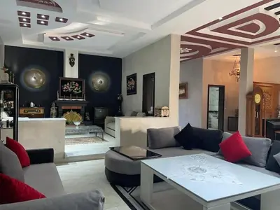 a living room with a couch and a table at Exclusive Villa Privée 5 Chambres Route de L Ourika in Sidi Bouzguia