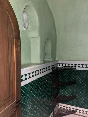 a bathroom with a green tiled floor and an arch at Exclusive Villa Privée 5 Chambres Route de L Ourika in Sidi Bouzguia