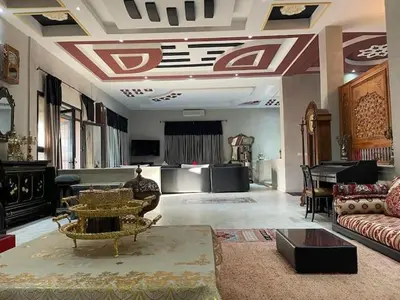 a large living room with a couch and a piano at Exclusive Villa Privée 5 Chambres Route de L Ourika in Sidi Bouzguia