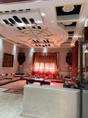 a large living room with couches and a table at Exclusive Villa Privée 5 Chambres Route de L Ourika in Sidi Bouzguia