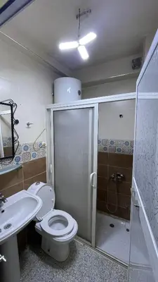 a bathroom with a shower and a toilet and a sink at Blange neige in Ifrane