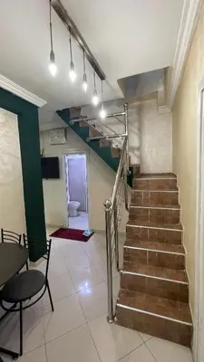 a stairway in a room with a stair railing at Blange neige in Ifrane