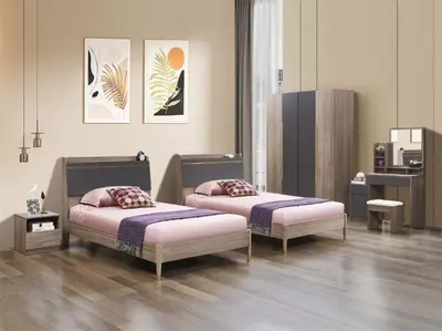 two beds with pillows in a room at Tanger in Oulad Akkou