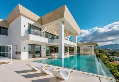 a house with a swimming pool in front of it at Tanger in Oulad Akkou